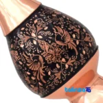 Detail view of Diamond Cut Flower and Bird Design Pot Set finish material