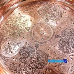 Detail view of Turquoise Inlaid Confectionery Bowl Decorative Copper nuts close-up texture