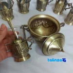 Packaging view of Brass Tea Set 19 Piece Handcrafted Engraved 12x12x10 cm label and