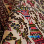 Persian Handwoven Carpet Qom Floral Design - Detail view showing pile texture close-up