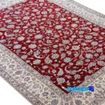 Weave close-up of Nain Handwoven Carpet Model Afshan Luxurious Red material and craftsmanship