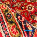 NKP Handwoven Carpet Red Design pile texture close-up (Detail view)