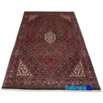 Weave close-up of C Persia Handwoven Carpet Red material and craftsmanship