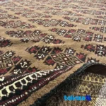 Weave close-up of Turkmen Handwoven Carpet Unique Design Brown material and craftsmanship