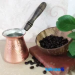 Copper Coffee Pot Traditional Craftsmanship finish and material detail view)