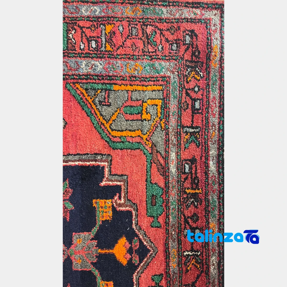 Corner detail of Turkmen Handwoven Area Rug Red Hand wash only binding and edges