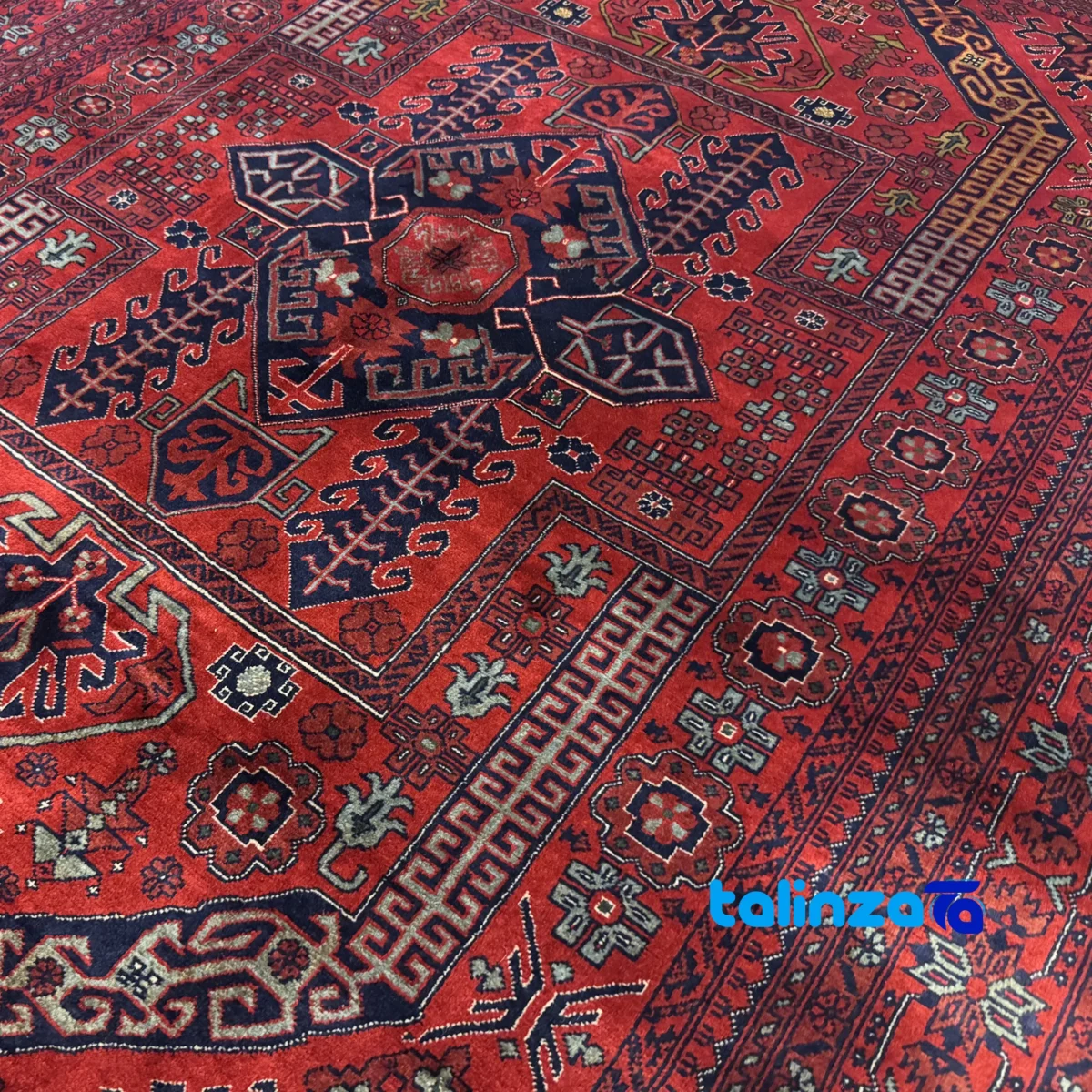 Corner detail of Handwoven Carpet Red Luxurious Design Hand wash binding and edges