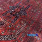 Corner detail of Handwoven Carpet Red Luxurious Design Hand wash binding and edges