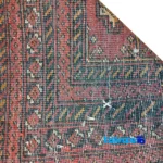 Edge view of NKP Handwoven Rug Red Traditional Design border and finishing
