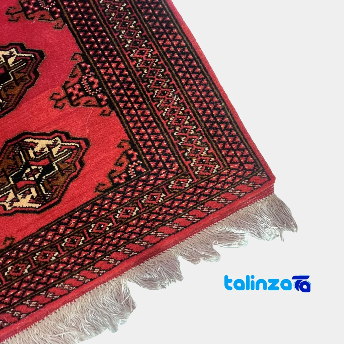 Edge view of Traditional Handwoven Red Turkmen Carpet Hand wash only border and finishing