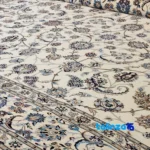 Corner detail of Nain Handwoven Carpet Afshan Design Cream binding and edges