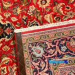 NKP Handwoven Carpet Red Design - Edge view showing border and finishing