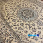 Edge view of Nayin Handwoven Carpet Sun Design border and finishing