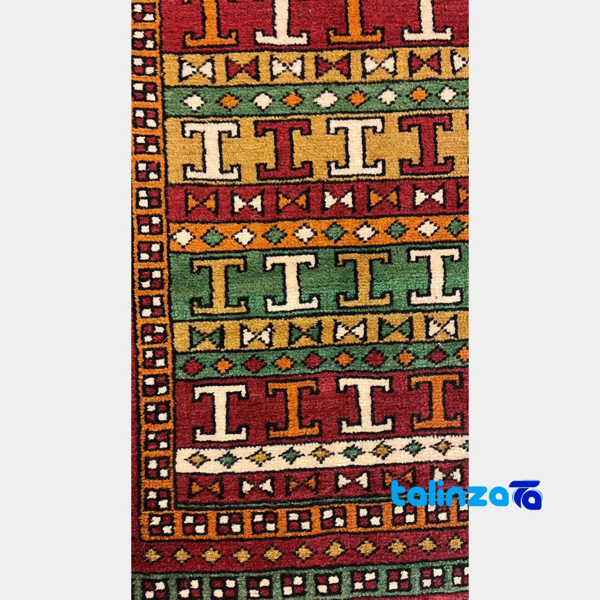 Corner detail of Turkmen Handwoven Carpet Red Design binding and edges