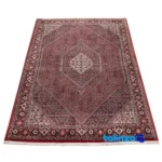 C Persia Handwoven Carpet Red - Corner detail showing binding and edges