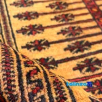 Handwoven Red Baloch Runner Rug - Corner detail showing binding and edges