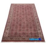 Edge view of C Persia Handwoven Rug - Luxurious Red Design 196x102x1 cm border and finishing