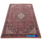 Corner detail of Persia Handwoven Rug Red Design binding and edges