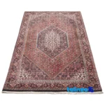Edge view of Cypress Persian Handwoven Rug Red border and finishing