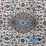 Kashan Handwoven Carpet Joyful Design - Corner detail showing binding and edges