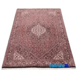 Edge view of Si Persia Handwoven Carpet Red Design 176x110x1 cm border and finishing