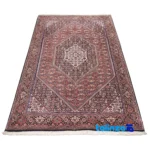 Corner detail of Si Persia Handwoven Rug Red binding and edges
