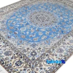 Corner detail of Nain Handwoven Rug Traditional Design Blue binding and edges
