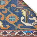 Edge view of NKP Handwoven Rug Red Traditional Design border and finishing