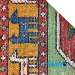Edge view of NKP Handwoven Area Rug Red Traditional Design border and finishing