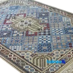Corner detail of Nain Handwoven Carpet Blue Traditional Design binding and edges