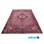 Corner detail of C Persia Handwoven Rug Elegant Peach Design Handwash only binding and edges