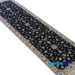 Corner detail of Nain Handwoven Area Rug Floral Design Navy Hand washable binding and edges