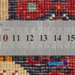 Handwoven Persian Rug Baloch Design Cream Background - In-room view showing room styling and scale