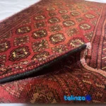 In-room view of Baloch Handwoven Area Rug Red room styling and scale