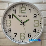 Welder Quartz Wall Clock Night Glow Feature room decoration context (Lifestyle shot)