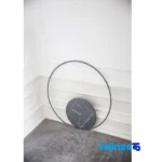 X Products Round Wall Clock Handmade Stone Design - Lifestyle shot showing room decoration context