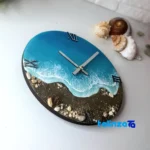 Resin Wall Clock Ocean Design - Package front showing product labeling and brand