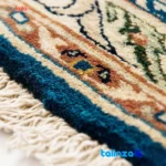 Weave close-up of Traditional Handwoven Carpet Blue Floral Design material and craftsmanship