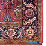 Weave close-up of Handwoven Persian Rug Geometric Design Red material and craftsmanship