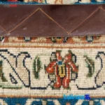 Traditional Handwoven Carpet Blue Floral Design - Corner detail showing binding and edges