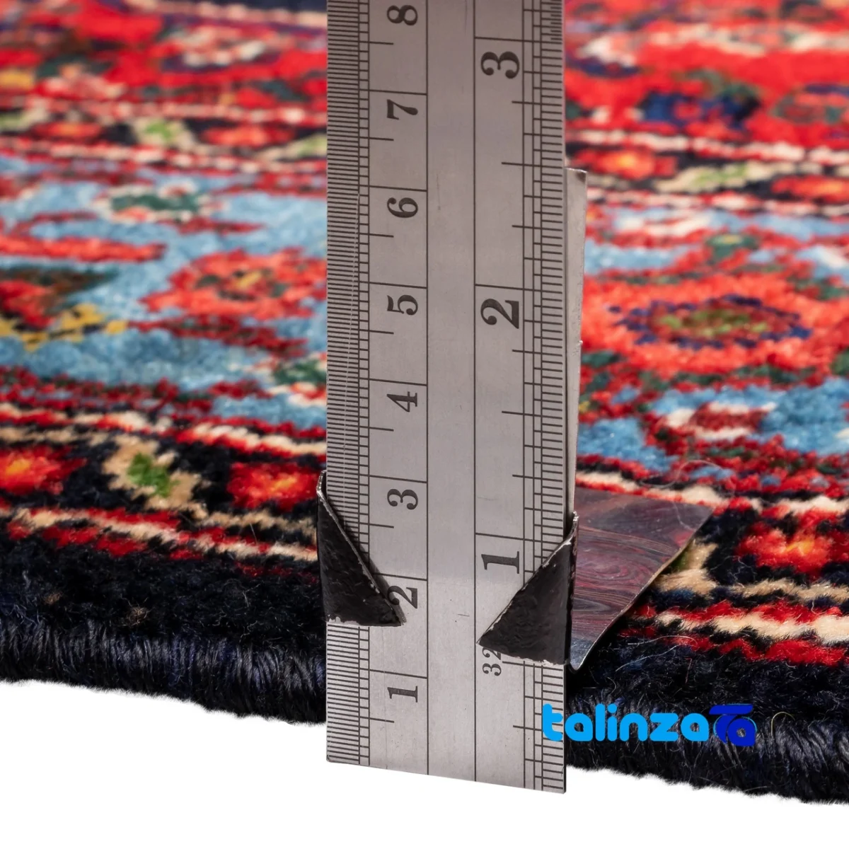 Edge view of C Persia Handwoven Rug Red Design border and finishing