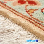 Edge view of Handwoven Persian Rug - Floral Design border and finishing