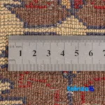 Corner detail of Handwoven Persian Rug Baloch Design Natural Dye Cream binding and edges