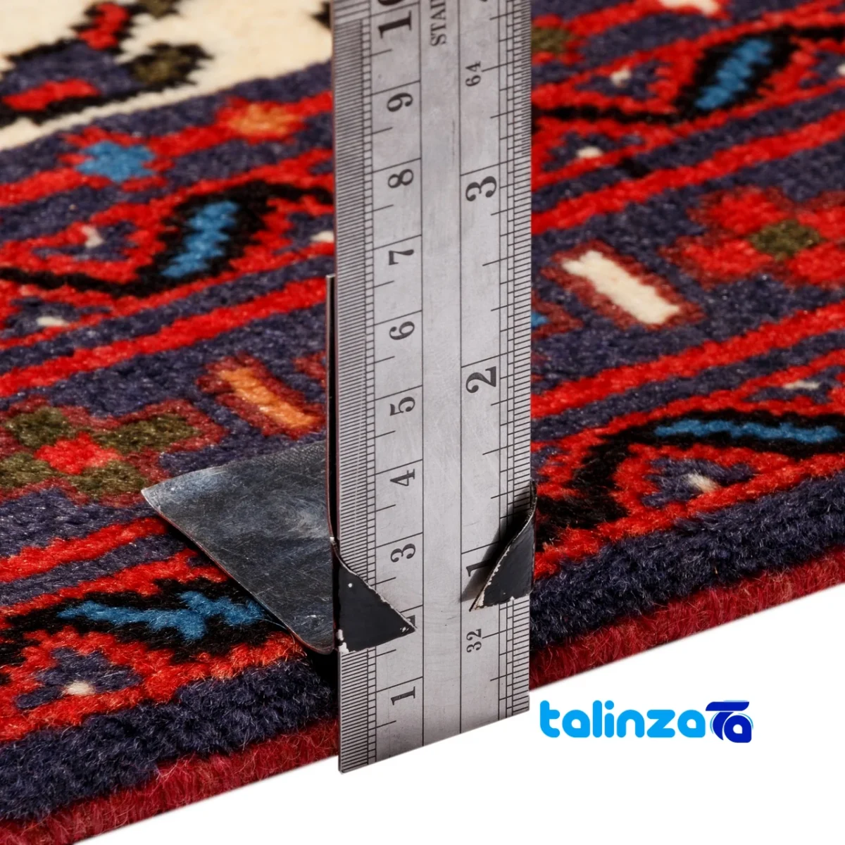 Corner detail of Persia Handwoven Carpet Beige Design 187204 binding and edges