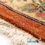 Handwoven Carpet Red Floral Design - Edge view showing border and finishing