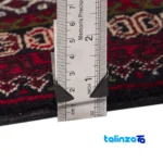 Corner detail of Persia Handwoven Carpet Navy Blue binding and edges
