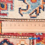 Edge view of C Persia Handwoven Rug Geometric Design Green border and finishing