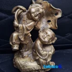 Detail view of Bronze Sculpture Two Sisters Lily Design finish and material