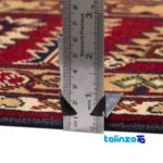 C Persia Handwoven Rug - Luxurious Red Design - Edge view showing border and finishing