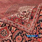 Cypress Persian Handwoven Rug Red 255x248x2 cm - In-room view showing room styling and scale